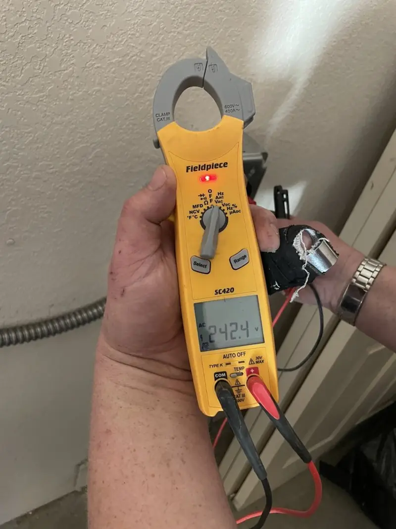 Voltage testing with clamp meter during Ceiling Fan Installation in Anniston